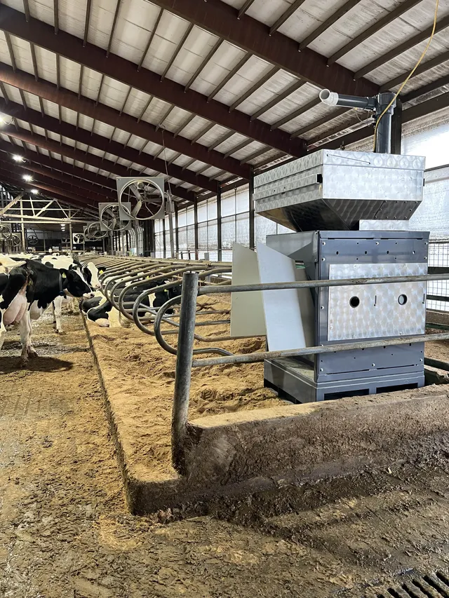 Emissions monitoring unit installed at the feed bunk of a freestall barn at Grass Ridge Farm